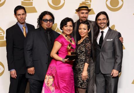 Quetzal Flores (furthest left) and the band at the 2013 Grammy Awards ceremony. (Photo courtesy of Frederick M. Brown/Getty Images)